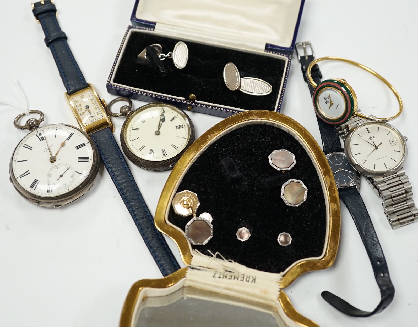 A late Victorian silver open face pocket watch, by J.W. Benson, a Swiss white metal fob watch, a lady's Gucci watch with interchangeable bezels, a pair of engine tuned silver cufflinks, and other sundry watches and jewel